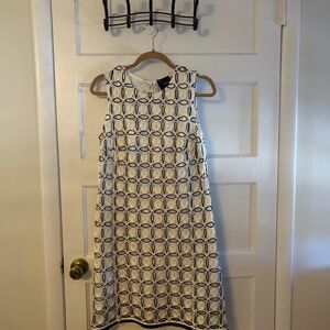 Great for summer weddings!Sleeveless lined cutout dress